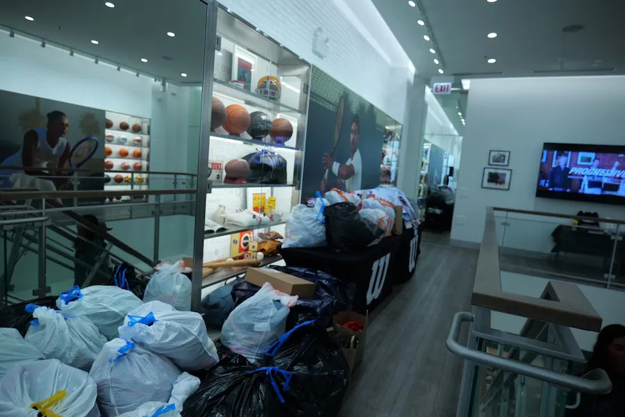 Photo of donated items and clothes for community drives.